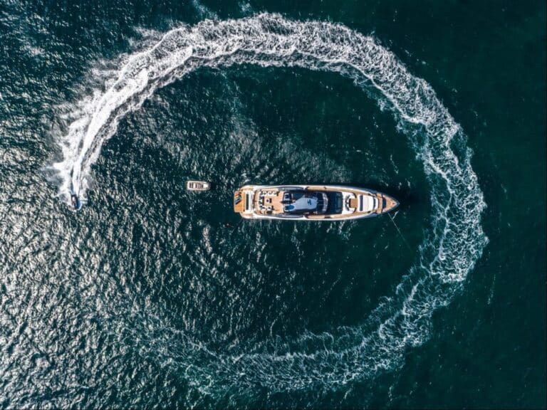 Aerial view of a yacht circling