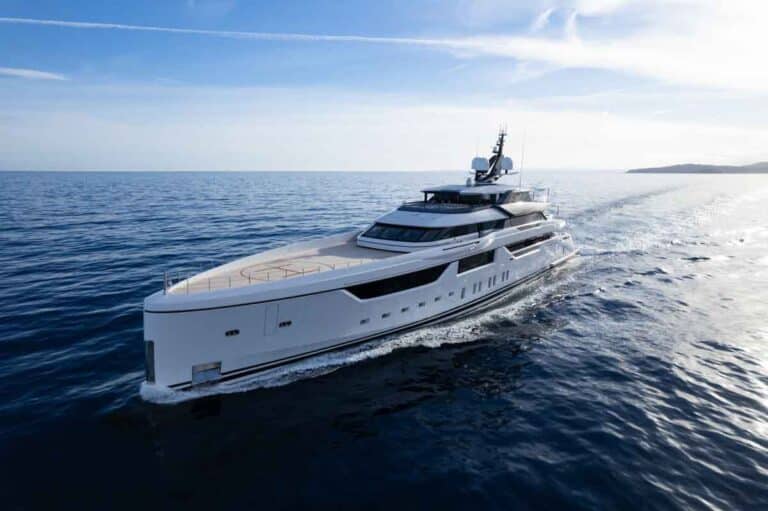 Motor yacht cruising under a blue sky