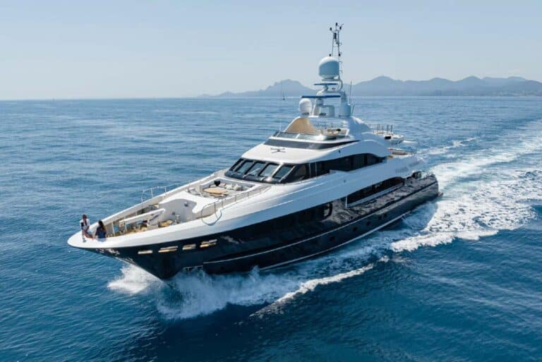 Motor yacht under way with guests on deck