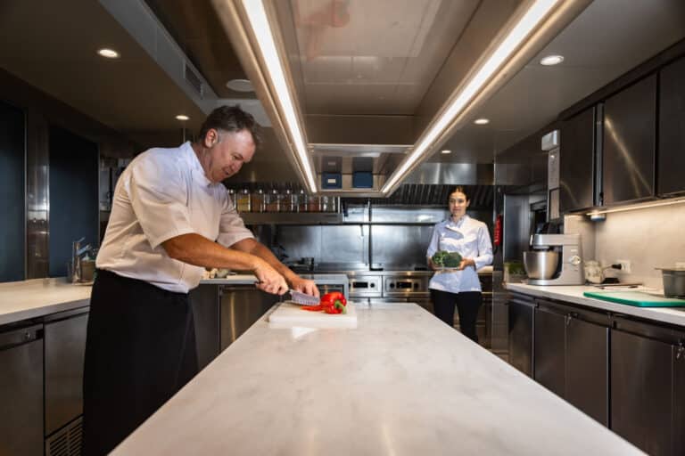 Chef preparing a meal in the yacht galley