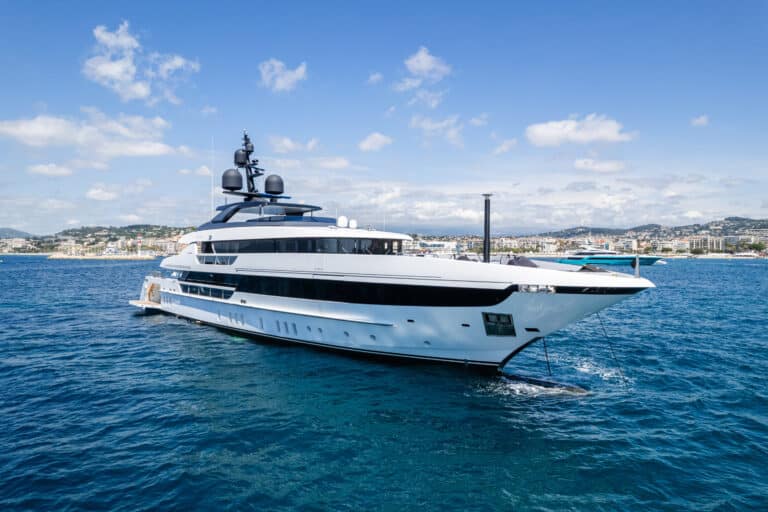 White yacht at sea under a blue sky