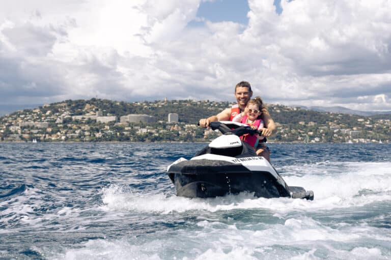 Two guests riding a jet ski