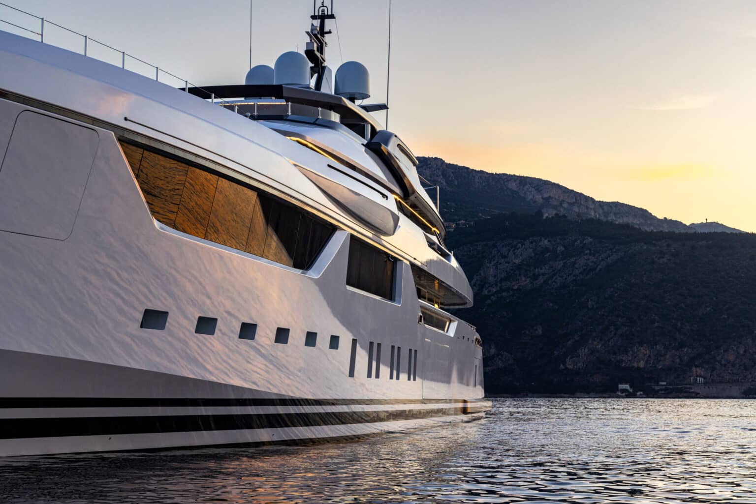 Superyacht hull at sunset