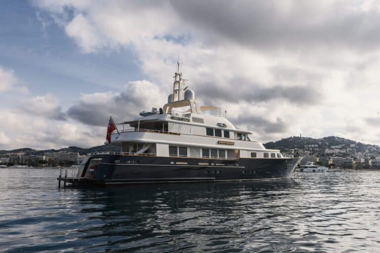 Explorer yacht at anchor under a cloudy sky