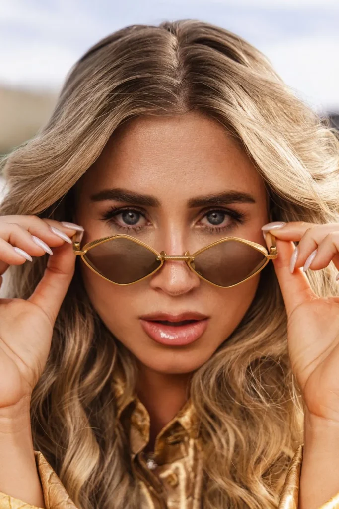 Beauty editorial portrait with gold sunglasses